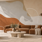 Décor mural panoramique Sillage Ocre dans un salon contemporain aux accents terracotta